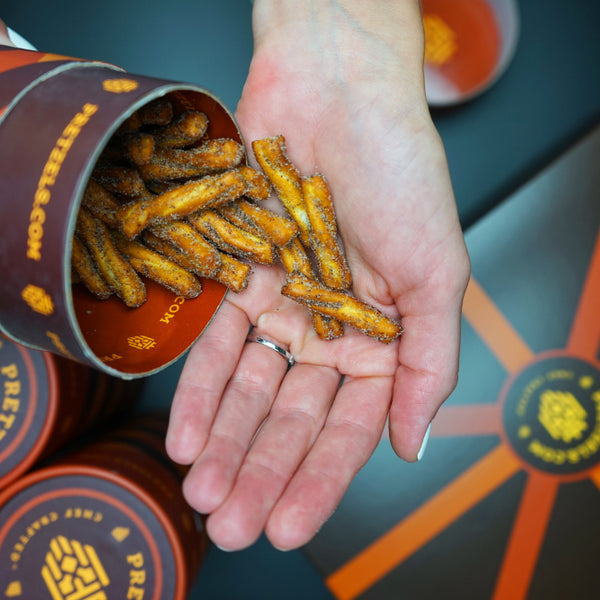 Gourmet pretzels being poured into hand